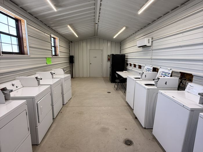 The laundry room at Rangers RV Park with coin-operated washers and dryers